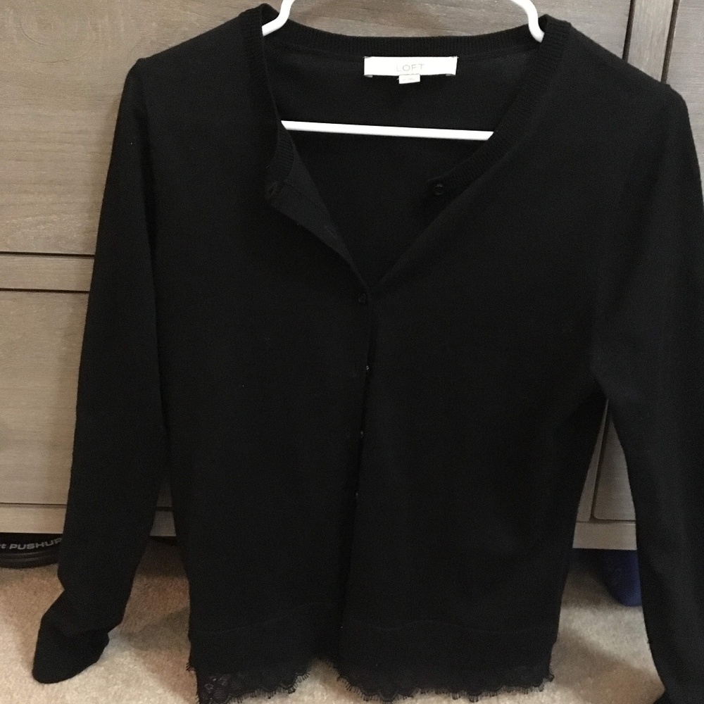 Black cardigan with lace trim detail on bottom